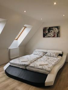 a bedroom with a bed in a attic at Heřmanov 141 in Jindřichovice