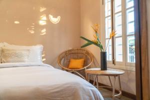 Postel nebo postele na pokoji v ubytování THE SLOW vegan hotel
