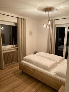Postel nebo postele na pokoji v ubytování Apartments Torggl