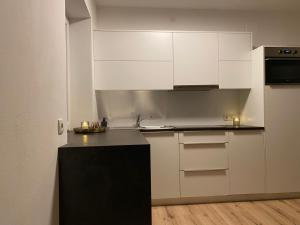 Kuchyň nebo kuchyňský kout v ubytování Apartments Torggl