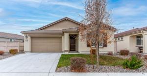 a house with a driveway and a garage at Dream Family Home in South Reno 4 bed 30 Min to Lake Tahoe in Steamboat