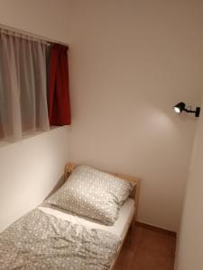 Posteľ alebo postele v izbe v ubytovaní Wash House Apartman