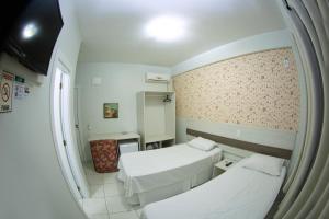 Postelja oz. postelje v sobi nastanitve Hotel Sambakia