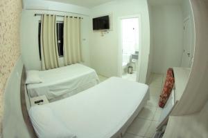 Postelja oz. postelje v sobi nastanitve Hotel Sambakia