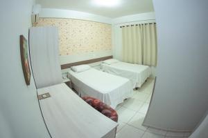 Postelja oz. postelje v sobi nastanitve Hotel Sambakia