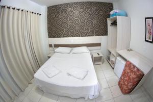 Postelja oz. postelje v sobi nastanitve Hotel Sambakia