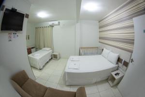 Postelja oz. postelje v sobi nastanitve Hotel Sambakia