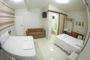 Postelja oz. postelje v sobi nastanitve Hotel Sambakia