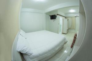 Postelja oz. postelje v sobi nastanitve Hotel Sambakia