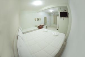 Postelja oz. postelje v sobi nastanitve Hotel Sambakia
