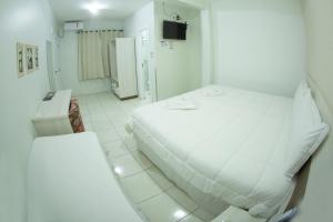 Postelja oz. postelje v sobi nastanitve Hotel Sambakia