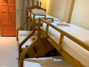 A bunk bed or bunk beds in a room at Susada's Inn