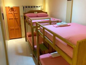 A bunk bed or bunk beds in a room at Susada's Inn