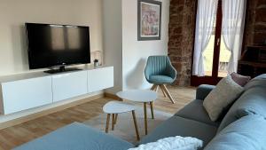 TV a/nebo společenská místnost v ubytování Appartement chaleureux et cocooning à Barr - Escapade chez Valentine
