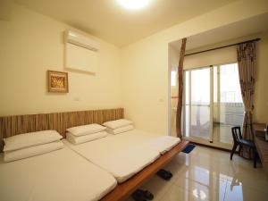 Voodi või voodid majutusasutuse Plum Green Homestay toas