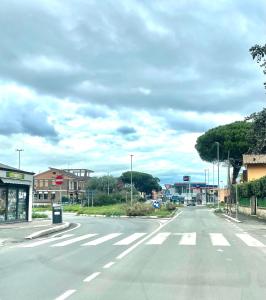 an empty street in a town on a cloudy day at HOLIDAY HOME ROMA LacasadiValentina in Rome