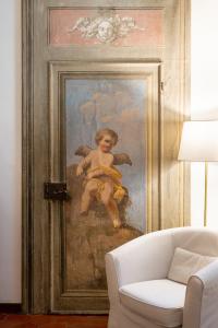 a painting of a painting of a boy with a banana at Palazzo D'Ambra Residenza d'Epoca in Florence