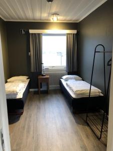 מיטה או מיטות בחדר ב-Aktivitetsbyen Gamle Fredrikstad
