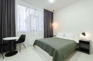 Posteľ alebo postele v izbe v ubytovaní Smart hotel apartment with panoramic city view in Diplomat Hall