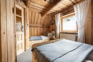 Postel nebo postele na pokoji v ubytování Domki Javorina + 37 fotografií