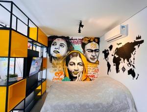 a bedroom with a map of the world painted on the wall at Flat Libertad, 404 A, com vaga de garagem in Pelotas