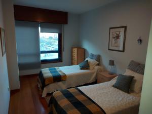Posteľ alebo postele v izbe v ubytovaní Apartamento Náutico