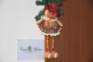 a teddy bear ornament hanging on a wall at Casa Marino in Sorrento