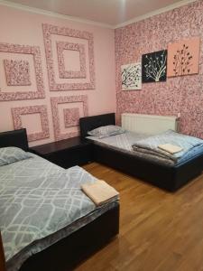 Кровать или кровати в номере Guest House on Oktyabrskaya 5