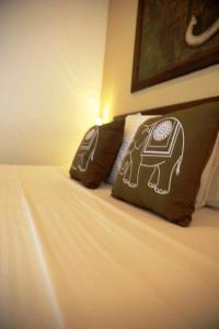 Voodi või voodid majutusasutuse Mihisara Resort toas