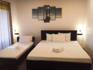 Voodi või voodid majutusasutuse Mihisara Resort toas