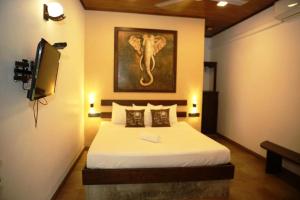 Voodi või voodid majutusasutuse Mihisara Resort toas