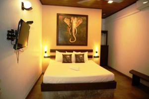 Voodi või voodid majutusasutuse Mihisara Resort toas