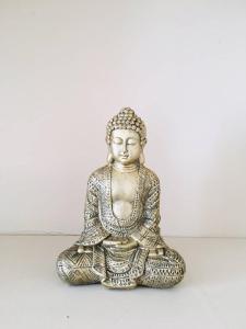 a statue of a buddha sitting on a table at Bienvenue chez l'habitant in Provins