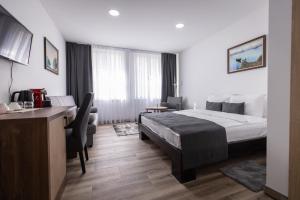 Postel nebo postele na pokoji v ubytování Vila Greta by Hotel Ramonda + 37 fotografií