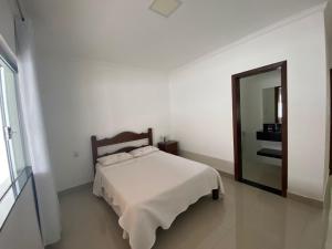 Ένα ή περισσότερα κρεβάτια σε δωμάτιο στο Casa Moderna