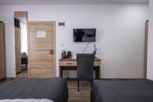 TV a/nebo společenská místnost v ubytování Vila Greta by Hotel Ramonda