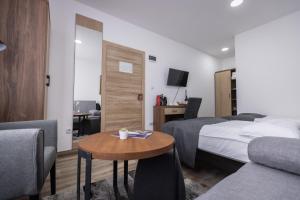 Postel nebo postele na pokoji v ubytování Vila Greta by Hotel Ramonda