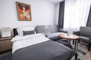 Postel nebo postele na pokoji v ubytování Vila Greta by Hotel Ramonda