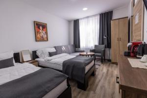 Postel nebo postele na pokoji v ubytování Vila Greta by Hotel Ramonda