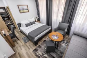 Postel nebo postele na pokoji v ubytování Vila Greta by Hotel Ramonda