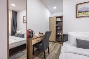 Postel nebo postele na pokoji v ubytování Vila Greta by Hotel Ramonda