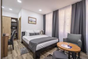 Postel nebo postele na pokoji v ubytování Vila Greta by Hotel Ramonda