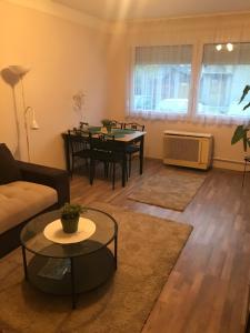 a living room with a couch and a table at Menta apartman in Szolnok