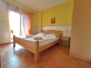 Postel nebo postele na pokoji v ubytování Apartmani Tomić 4*
