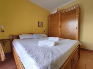 Postel nebo postele na pokoji v ubytování Apartmani Tomić 4*