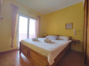 Postel nebo postele na pokoji v ubytování Apartmani Tomić 4*