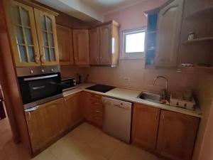 Kuchyň nebo kuchyňský kout v ubytování Apartmani Tomić 4*