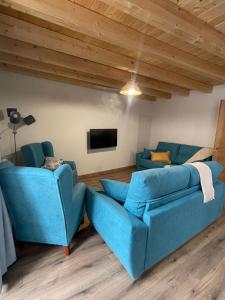 TV a/nebo společenská místnost v ubytování Apartamentos turísticos Ribera Natura