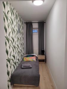 Katil atau katil-katil dalam bilik di Apartamenty Cieplicka 20