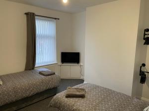 Postel nebo postele na pokoji v ubytování Bedlington apartment